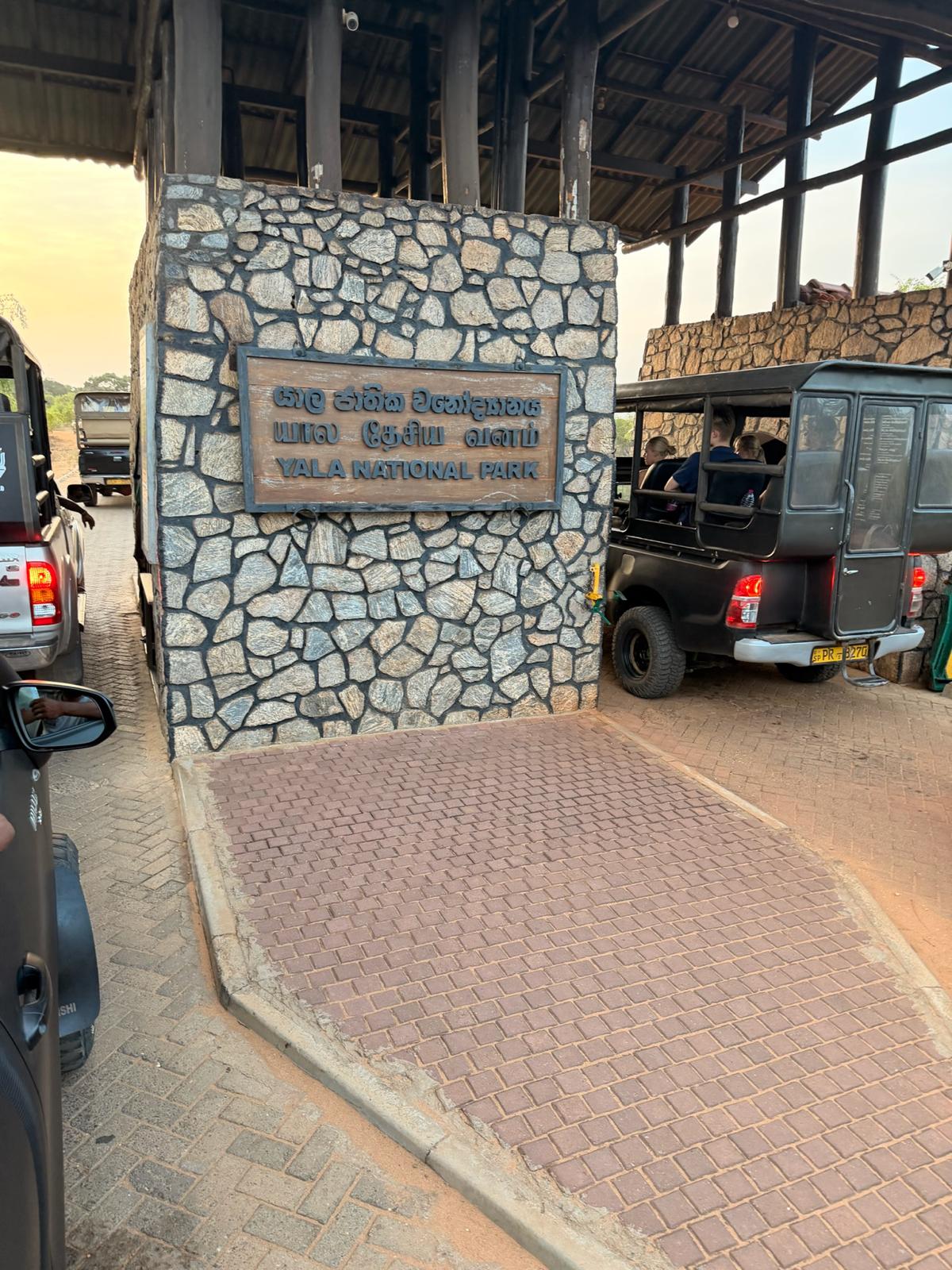 Yala National Park entrance with safari jeeps in Sri Lanka