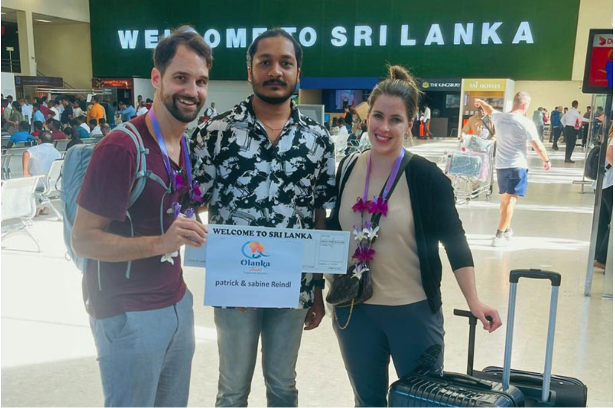 Couple meeting their Sri Lanka private driver at Colombo airport with luggage