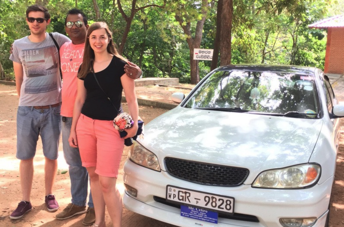 Couple meeting a Sri Lanka private driver beside the arranged car