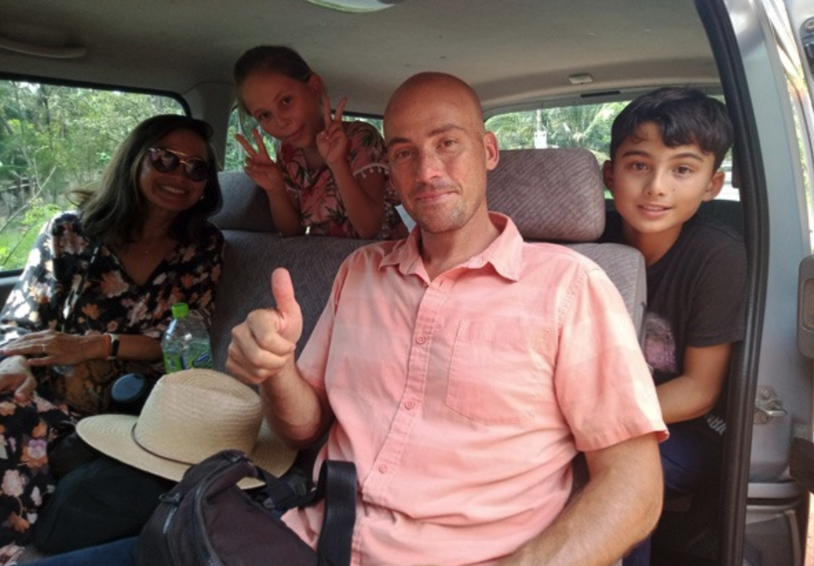 Family travellers checking the usable space inside a Sri Lanka charter vehicle