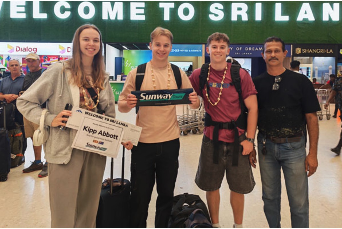 Young travellers meeting their private driver with luggage at Colombo airport